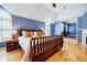 A bright bedroom featuring wood floors, stylish furniture, and a cozy ambiance at 656 Gunby Se Rd, Marietta, GA 30067