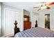 Bedroom featuring hardwood floors, ceiling fan, and double closets at 656 Gunby Se Rd, Marietta, GA 30067