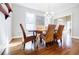 Dining room showcasing natural light, hardwood floors and modern furniture at 656 Gunby Se Rd, Marietta, GA 30067