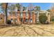 Beautiful two story brick home with dormer windows and a manicured front yard at 656 Gunby Se Rd, Marietta, GA 30067