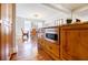 Kitchen island with granite counters, a built-in microwave, and custom cabinets for storage at 656 Gunby Se Rd, Marietta, GA 30067