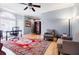 Comfortable living room with a ceiling fan, arm chairs, and a red rug at 656 Gunby Se Rd, Marietta, GA 30067