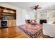 Bright living room boasts an attractive drink station and classic wood floors at 656 Gunby Se Rd, Marietta, GA 30067