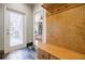 Mudroom featuring a tiled floor, wooden bench, and coat hooks at 656 Gunby Se Rd, Marietta, GA 30067