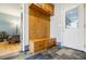 Mudroom features a tiled floor, wooden bench, and coat hooks at 656 Gunby Se Rd, Marietta, GA 30067