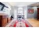 Bright office space featuring large windows, hardwood floors, and stylish rug at 656 Gunby Se Rd, Marietta, GA 30067