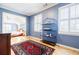 Inviting sitting room boasting wood floors, blue walls, and ample natural light at 656 Gunby Se Rd, Marietta, GA 30067