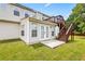 Exterior showcasing backyard with deck, patio, and well-maintained lawn at 1543 Blossom Dr, Atlanta, GA 30349