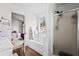 Bright bathroom showcasing a tub, separate shower, and a glimpse into the connected bedroom at 1543 Blossom Dr, Atlanta, GA 30349