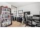 Bedroom featuring a mirrored closet, dark shelving, and a functional workspace at 1543 Blossom Dr, Atlanta, GA 30349