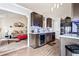 Open-concept kitchen with stainless steel appliances, and dark wood cabinets at 1543 Blossom Dr, Atlanta, GA 30349
