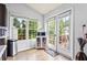 Bright kitchen nook with lots of light and a view to a wooden deck at 1543 Blossom Dr, Atlanta, GA 30349