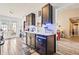 Stylish kitchen with stainless steel appliances, dark wood cabinets, and an adjacent dining area at 1543 Blossom Dr, Atlanta, GA 30349