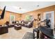 Open living area with a large sectional, a wet bar, and plenty of natural light at 1543 Blossom Dr, Atlanta, GA 30349