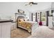Spacious primary bedroom with ceiling fan, carpet floors, and neutral decor at 1543 Blossom Dr, Atlanta, GA 30349