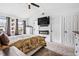 Main bedroom with carpet flooring, a ceiling fan, and a wall-mounted television at 1543 Blossom Dr, Atlanta, GA 30349
