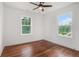 Bright bedroom with two large windows, hardwood floors, and a ceiling fan at 1721 S Gordon Sw St, Atlanta, GA 30310
