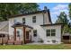 Side view of an attractive two-story home with a cozy porch and well-maintained landscaping at 1721 S Gordon Sw St, Atlanta, GA 30310