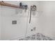 Functional laundry room with stylish floor tiles and overhead storage shelf at 1721 S Gordon Sw St, Atlanta, GA 30310