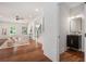 Open concept living room with hardwood floors, half bathroom and staircase at 1721 S Gordon Sw St, Atlanta, GA 30310