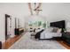 Bright main bedroom featuring exposed ceiling beams, a ceiling fan and ample natural light at 1721 S Gordon Sw St, Atlanta, GA 30310