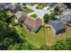 Aerial view of a spacious backyard with lush green grass and a residential property in a tranquil setting at 3547 Edenridge Ct, Buford, GA 30519