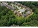 Aerial view of a residential area surrounded by lush greenery and a cul-de-sac showcasing the neighborhood's layout at 3547 Edenridge Ct, Buford, GA 30519