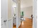 Charming powder room featuring a pedestal sink and elegant wainscoting detail with a dining area to the right at 3547 Edenridge Ct, Buford, GA 30519