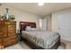 Comfortable bedroom with a cozy bed and a vintage dresser providing a relaxing and personal space at 3547 Edenridge Ct, Buford, GA 30519