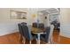 Elegant dining room with a chandelier, hardwood floors, and wainscoting at 3547 Edenridge Ct, Buford, GA 30519