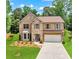 Charming two-story brick home with a well-manicured lawn and attached two-car garage at 3547 Edenridge Ct, Buford, GA 30519