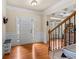 Welcoming foyer with hardwood floors, decorative wainscoting and a front door with sidelights at 3547 Edenridge Ct, Buford, GA 30519