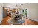 Spacious eat-in kitchen featuring hardwood floors, a breakfast area, and backyard access at 3547 Edenridge Ct, Buford, GA 30519