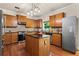 Well-equipped kitchen with stainless steel appliances, granite countertops, and a center island at 3547 Edenridge Ct, Buford, GA 30519