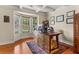 Cozy home office featuring a bay window, hardwood floors and elegant wood accents at 3547 Edenridge Ct, Buford, GA 30519