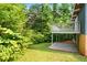 An expansive backyard featuring a deck, lush greenery, and ample space for outdoor activities and relaxation at 3861 Foxford Dr, Atlanta, GA 30340