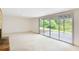 Spacious carpeted basement with fireplace and sliding glass doors to the backyard at 3861 Foxford Dr, Atlanta, GA 30340