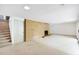 Unfurnished basement featuring carpet flooring, brick fireplace, and stair access at 3861 Foxford Dr, Atlanta, GA 30340