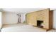 Unfurnished basement featuring brick fireplace, carpet flooring, and stair access at 3861 Foxford Dr, Atlanta, GA 30340
