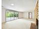 Basement features walk-out sliding doors, brick fireplace, and plush carpeting at 3861 Foxford Dr, Atlanta, GA 30340