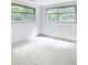 Bright bedroom with ample light from the surrounding trees shining through the two large windows at 3861 Foxford Dr, Atlanta, GA 30340