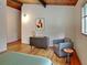 Relaxing bedroom showcases wood floors, furniture, and a window for natural light at 3861 Foxford Dr, Atlanta, GA 30340