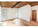 Spacious bedroom with hardwood floors, wood plank ceiling, and natural light at 3861 Foxford Dr, Atlanta, GA 30340