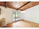 Bright dining room with hardwood floors, wood ceiling, and large windows offering an outdoor view at 3861 Foxford Dr, Atlanta, GA 30340