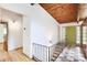 Bright entryway features hardwood floors, wood-paneled ceiling and front door at 3861 Foxford Dr, Atlanta, GA 30340