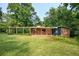 Expansive lawn and covered patio enhance the curb appeal of this brick home at 3861 Foxford Dr, Atlanta, GA 30340