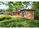Charming brick home with a covered patio and lush, green landscaping at 3861 Foxford Dr, Atlanta, GA 30340