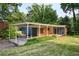 Charming single-story home with a carport and well-manicured lawn with mature trees, offering curb appeal at 3861 Foxford Dr, Atlanta, GA 30340