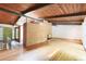 Spacious living room with hardwood floors, brick fireplace, and wood-paneled ceiling at 3861 Foxford Dr, Atlanta, GA 30340