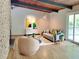Modern living room with hardwood floors, minimalist decor, and sliding glass doors at 3861 Foxford Dr, Atlanta, GA 30340